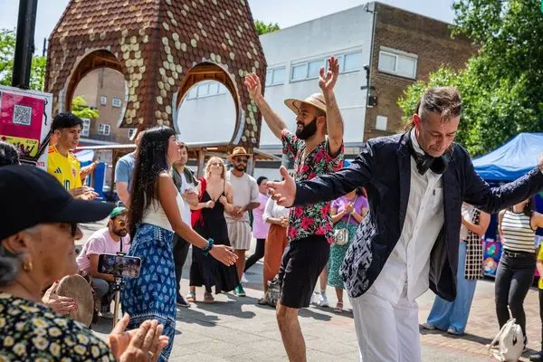Couples dancing at a Bermondsey Latino community celebration