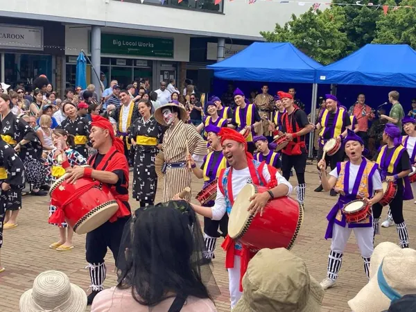 Drummers performing to a crowd at a Bermondsey community event